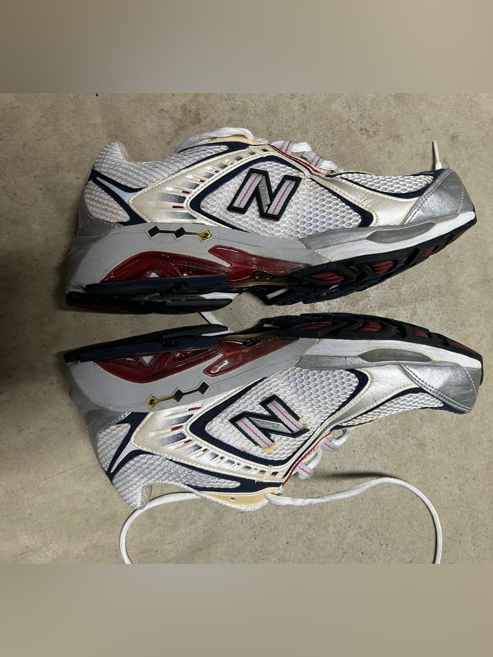 New balance, stability trainer tennis shoes. White & gray with red accents.